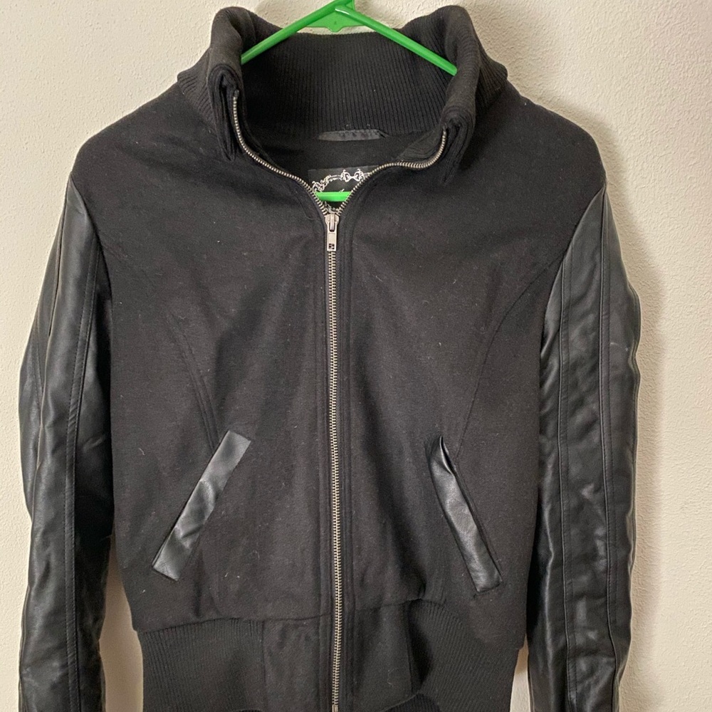 black jacket with leather sleeves